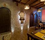 Palladian in travertine star in a restaurant in Rome.